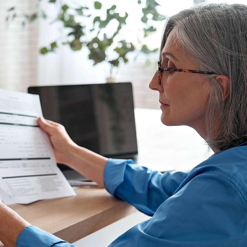 A woman reading paperwork